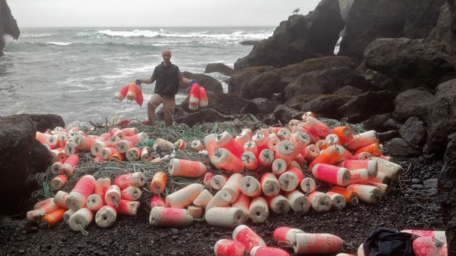 Surfrider volunteers Cleaning up debris from R/V Chevelle sinking last year